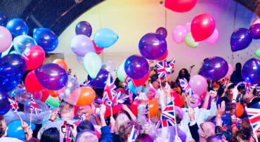 Celebrating reaching the end of Queen Mary II Voyage