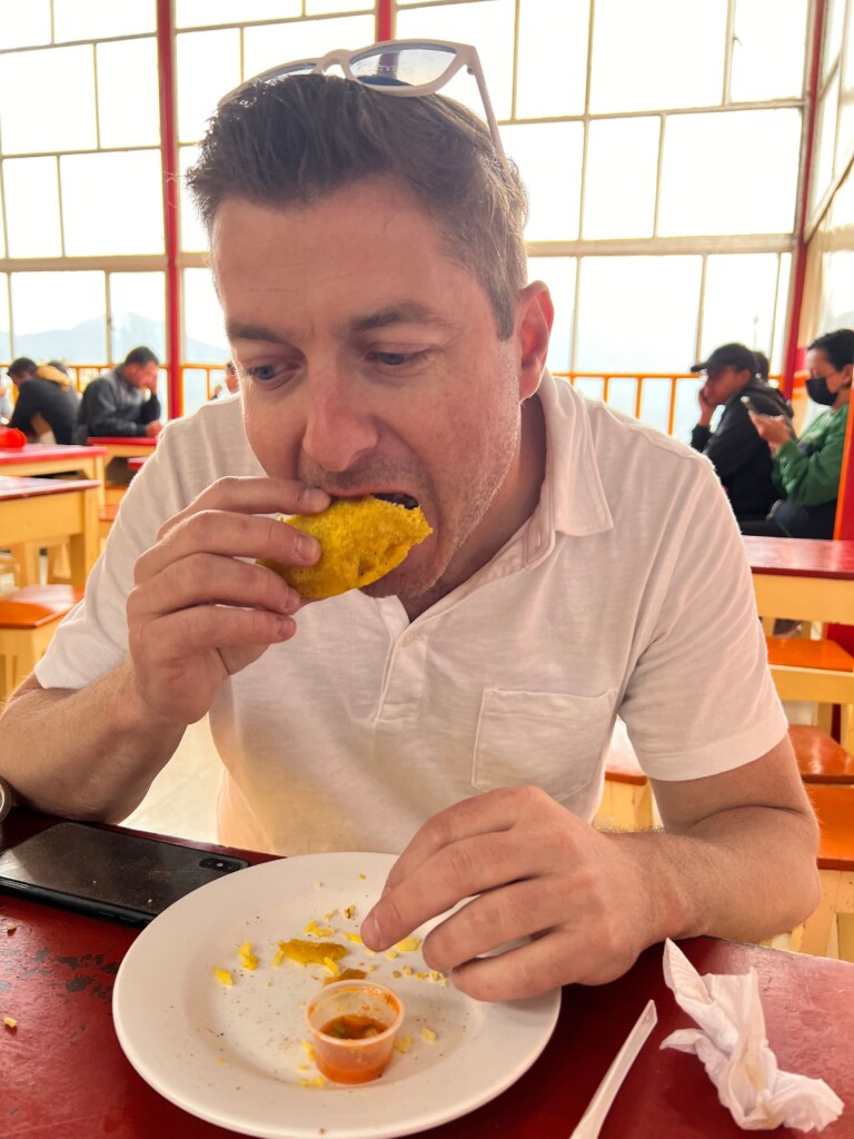 Sean eating at Monserrate market